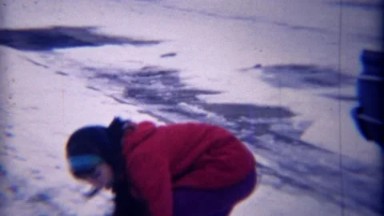 1971: Mixed Race Girl Friends Winter Snowball Fight Closeup.