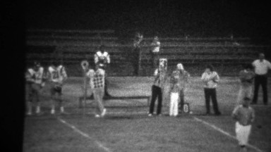 1978: High school football night game 3rd down sign on sidelines.