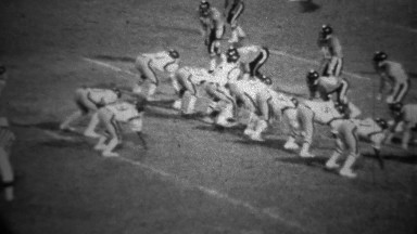 1978: High school football night game long running play.