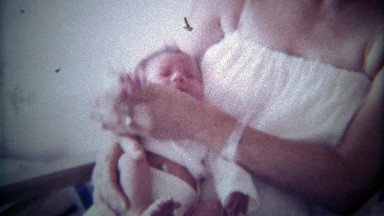 1978: Brother greets newborn sister baby for 1st time.