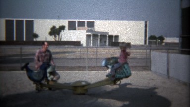 1979: Father son play see saw style park playground toy.