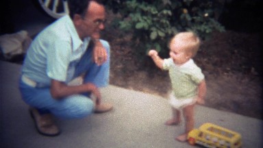 1979: Grandfather Greets Toddler Playing in Suburban Front Yard