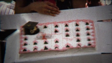 1973: High school graduation cake held by celebrated student.