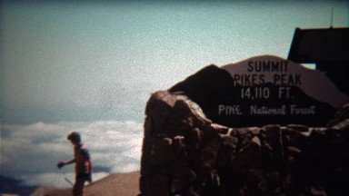 1972: Pikes Peak Summit sign and people walking past.