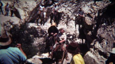 1972: Horse riding group coming down steep single dry track trail.