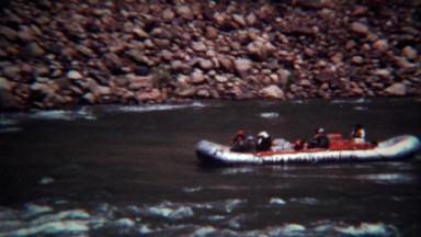 1972: Whitewater rafting guided tour down fast moving mountain river.