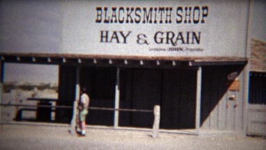 1972: Old time abandoned blacksmith shop selling hay and grain.