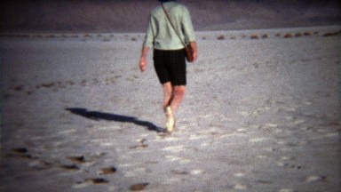 1971: Women walking on white salty dry lake bed in flat shoes.