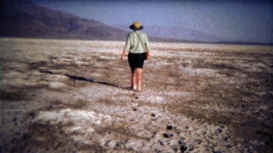1971: Women Walking on Dry Lake Bed Leaving Footprints in Deep Mud
