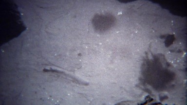 1971: White bubbling chalky natural volcanic milky liquid boiling.