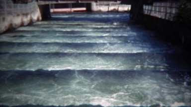 1971: River locks salmon ladder water flowing fish jumping.