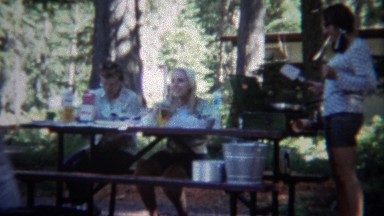 1967: Family Cooking Breakfast at Outdoor Camping Picnic Table in Yellowstone