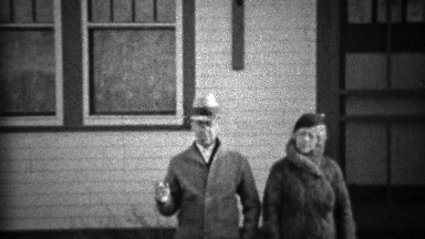 1933: Proud couple walking new farm property recently purchased.