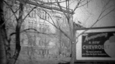 1933: Announcing new Chevrolet model car outdoor billboard sign.