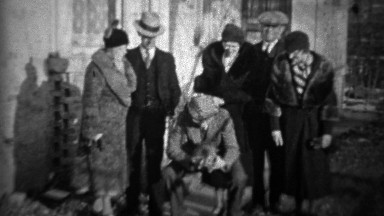 1933: Friends find stray kitten in formal 30's style clothing.