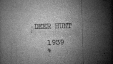 1939: Man leaving city house for classic car for deer hunt trip.