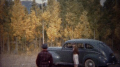 1940: Light Blue Sedan Parked in Autumn Forest at Grand Lake, Colorado