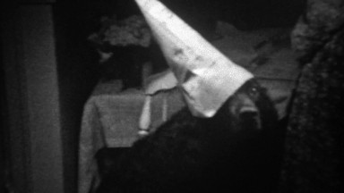 1939: Black Dog Shamed with Newspaper Dunce Hat Timeout