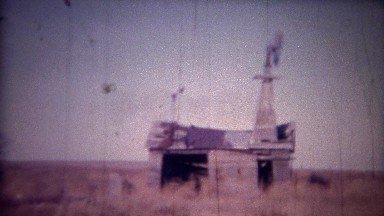 1956: Farm House Ruins of Windmill and Weather Worn Barn.