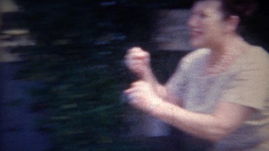 1956: Woman puts boxing fists up threatening with deadly right hook.