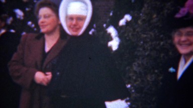 1948: Catholic nuns school graduation proud happy family.