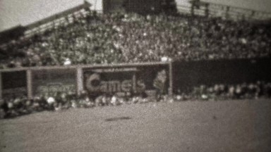 1945: Camel cigarettes advertising on baseball stadium center field.
