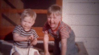 1949: Blonde Toddler Boys Playing on Sunny Summer Home Porch