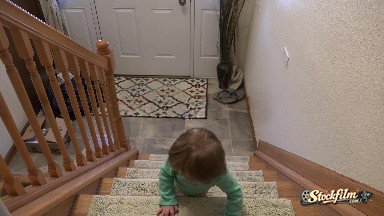 Denver, Colorado, United States: Toddler Crawling Down Staircase Backwards to Front Door.