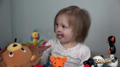 Denver, Colorado, United States: Toddler Soothing Teething Pain with Fingers in Mouth on Toy Setup.