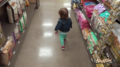 Following Jean Jacket Toddler at Pet Store Through Dry Dog Food Aisle. Denver,