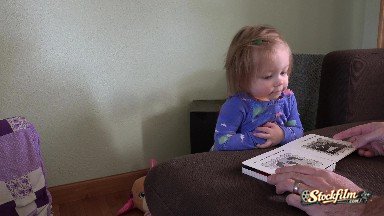 Dad Reading Book With Toddler Girl In Mourning Blue Pajamas. Denver, Colorado