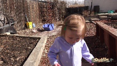 Baby Walking Outside Backyard Garden Landscaped Area Smiles. Denver, Colorado
