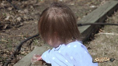 Closeup Baby Blonde Brown Hair Blowing in Wind Playing Rocks. Denver, Colorado