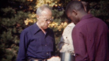 1944: African Waiter Serving Food to Caucasian Guests at Autumn Party in Tryon, NC