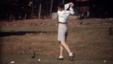 1945: Woman Practicing Golf Swing in Gray Shorts at Tryon, NC