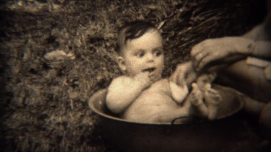 1936: Newborn Baby Bathed in Cooking Pot Outdoors, Tryon, NC