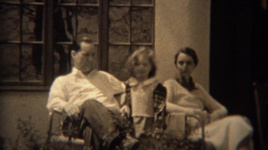1937: Stern smileless father with curly haired daughter and timid mother. TRYON,