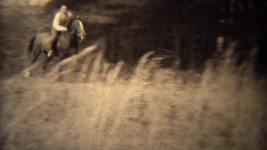 1937: Men jumping horses over fence loses hat in wooded rural area. TRYON, NC