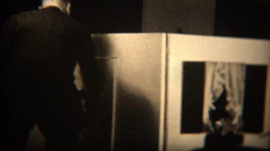 1937: Man visits wealthy daughters lifesize playhouse with realistic windows.
