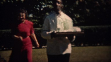 1937: African waiter tray of ice and drinks to rich white drunk patrons. TRYON,