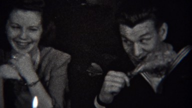 1943: Navy Sailor Slyly Eating Turkey Leg Makes Girlfriend Laugh