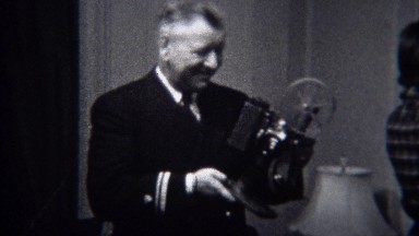 1944: Military General Inspects Modern Film Projector Technology in Miami