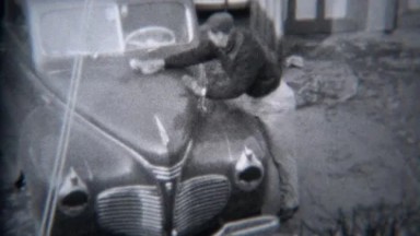 1944: Proud Man Washing and Polishing Classic Buick Car in Driveway Garage, Troy, New York