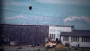 1946: Lumbermill factory smoke pouring from chimneys processing wood.