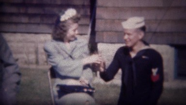 1947: US Navy Ensign Toasts Cocktail with Women Flirting Outdoors in Sun