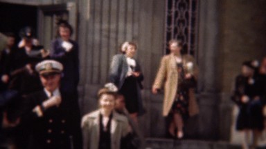 1947: Military man leaving church gets global atlas book gift.