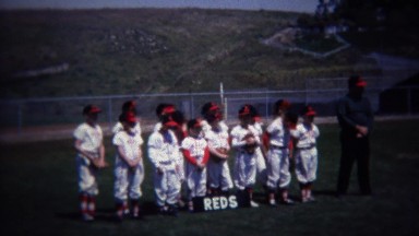 1972: Reds Little League Baseball Team Photo in Outfield