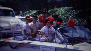 1972: Reds little league baseball team bully takes nerds hat.