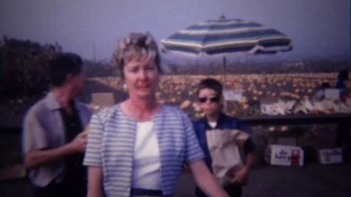 1967: Family at pumpkin farmers market roadside farmstand.