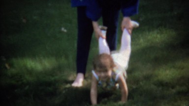 1973: Toddler Wheelbarrow Game Arm Strength Walking on Hands